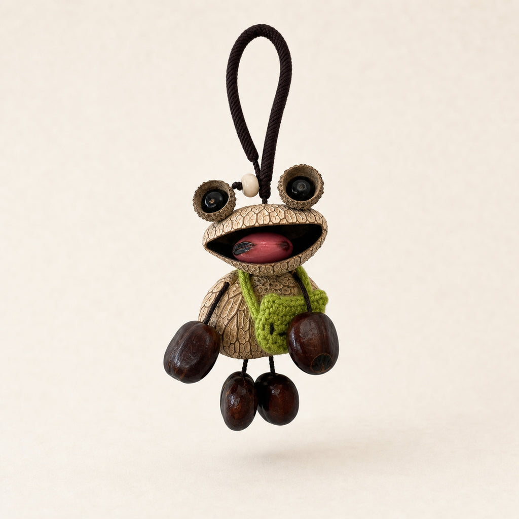 YUNOVA Big-Eye Frog natural seed pod hanging charm on a clean studio background
