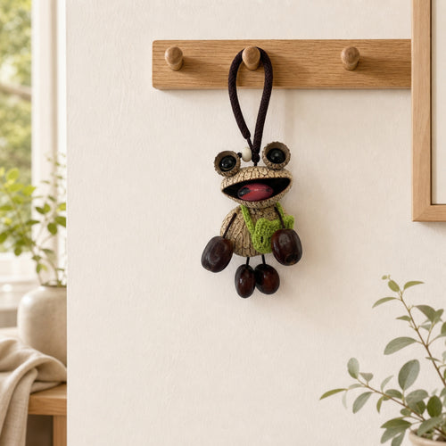 YUNOVA Big-Eye Frog hanging charm displayed on a home wall hook