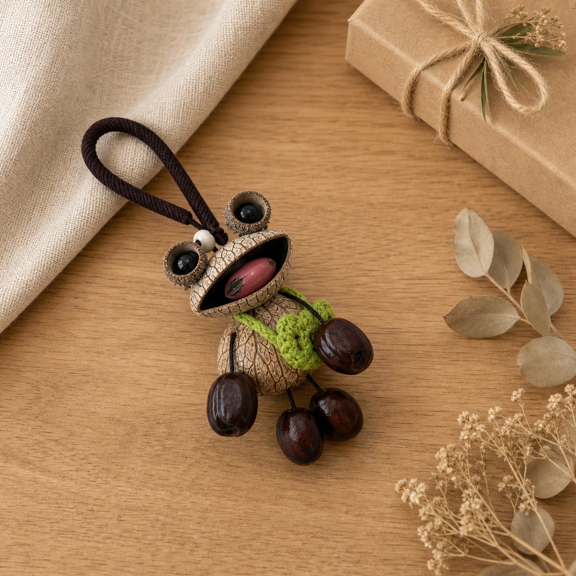 YUNOVA Big-Eye Frog handmade charm styled on a gift tabletop display