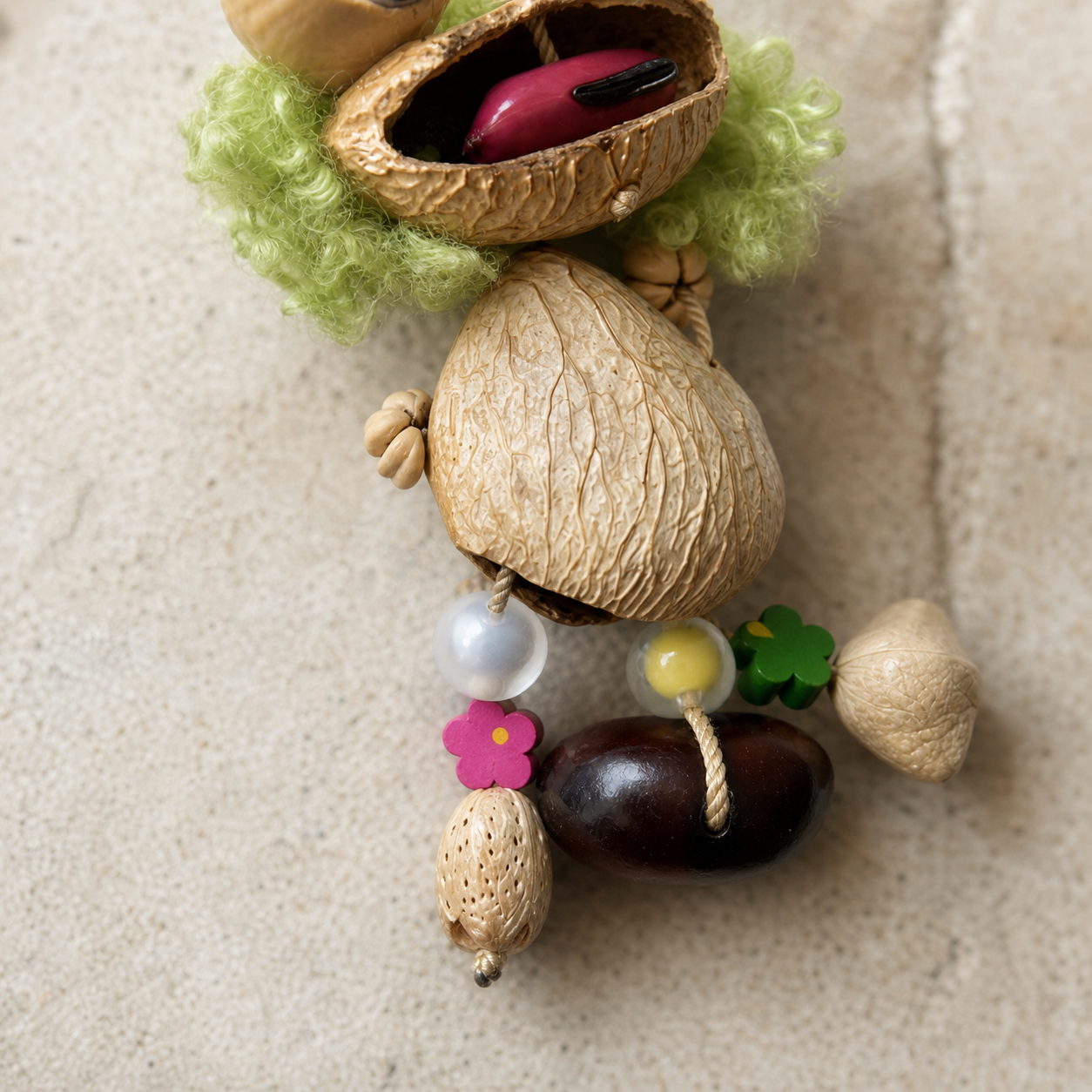 Close-up material detail of YUNOVA Curly Frog botanical hanging charm