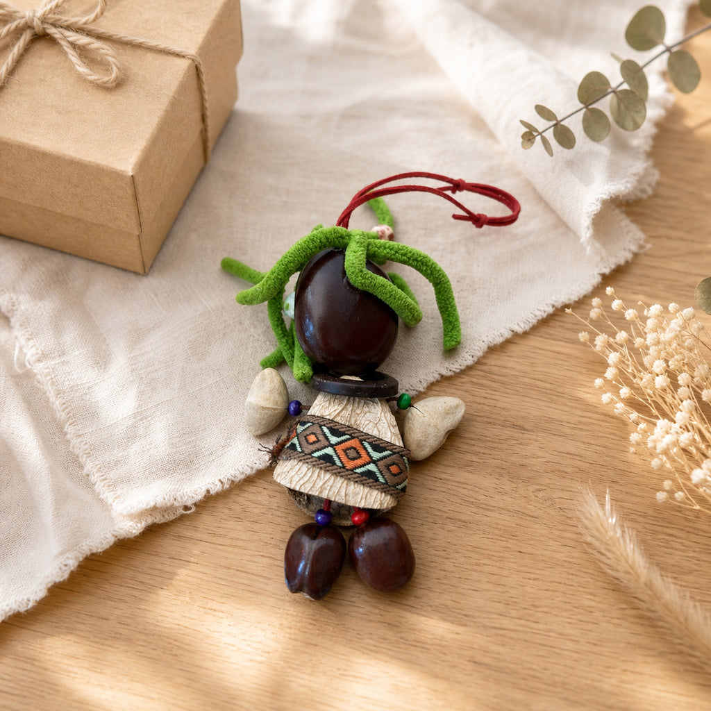 YUNOVA Dark Pod Doll handmade ornament styled on a gift tabletop display