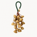 YUNOVA Golden Botanical Shell handmade wind chime on a clean studio background