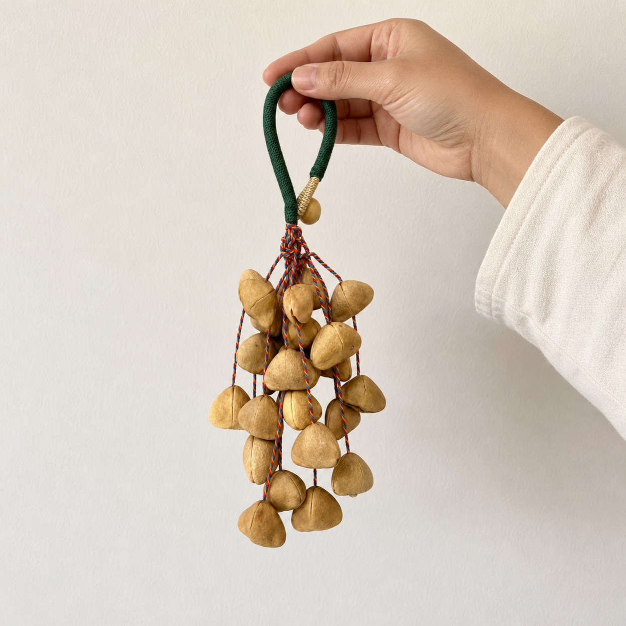 Handheld scale photo of YUNOVA Golden Botanical Shell handmade wind chime