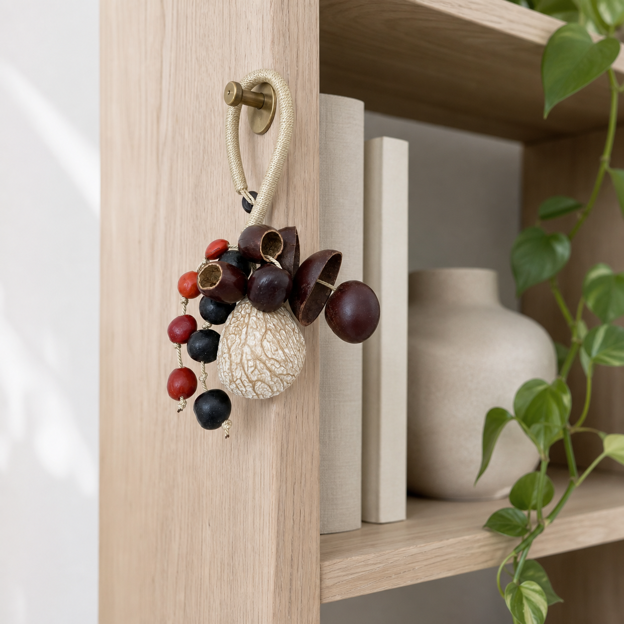 YUNOVA Mixed Botanical Shell Wind Chime B styled on a bookshelf bracket