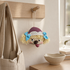 YUNOVA pod doll charm hanging from an oak entryway peg