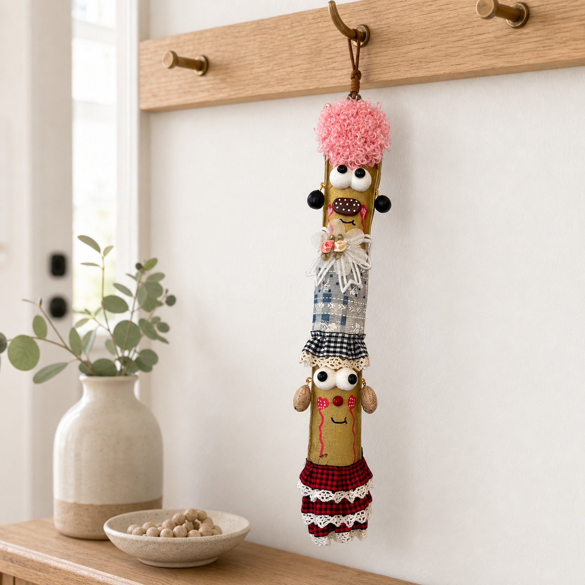 YUNOVA Sword Bean Pod Doll hanging ornament displayed on a home wall hook