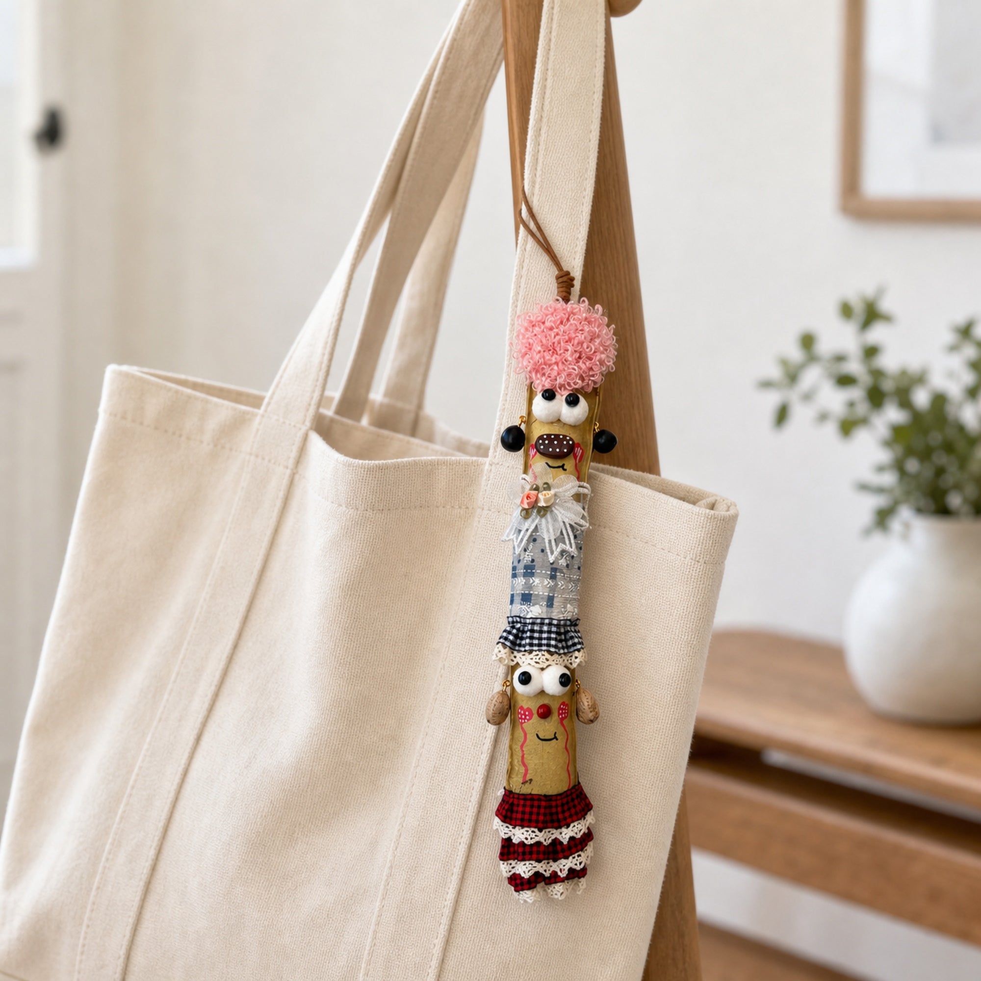YUNOVA Sword Bean Pod Doll natural hanging charm attached to a canvas tote bag