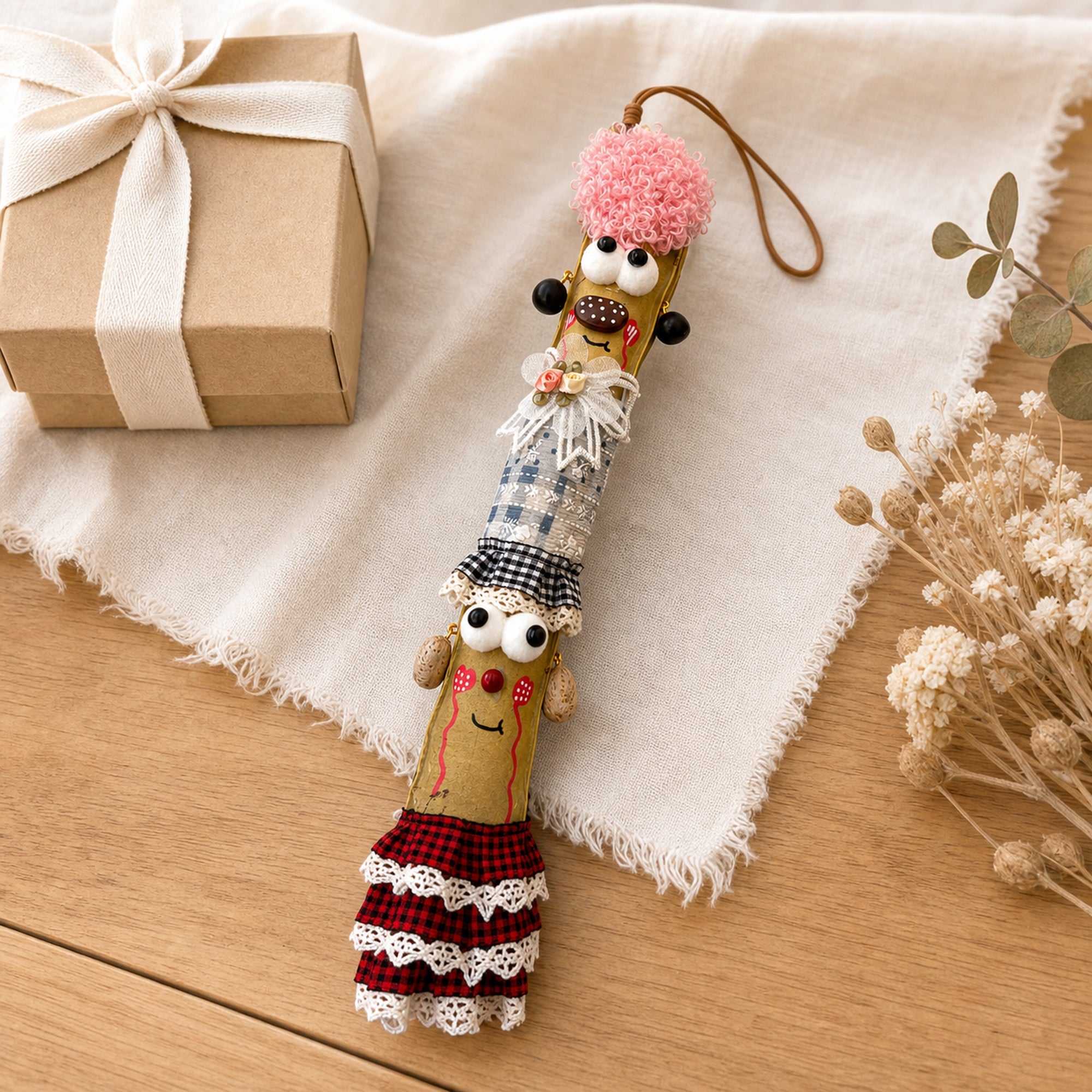 YUNOVA Sword Bean Pod Doll handmade ornament styled on a gift tabletop display